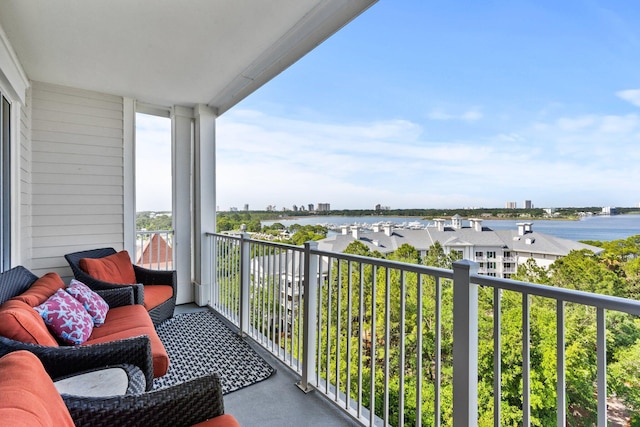 balcony featuring a water view
