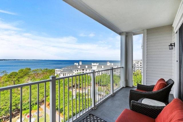 balcony featuring a water view