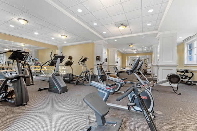 workout area featuring crown molding, recessed lighting, decorative columns, and a paneled ceiling