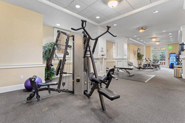 gym with recessed lighting, ornamental molding, and carpet