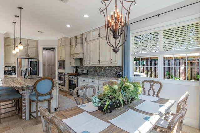 dining room featuring a notable chandelier, crown molding, recessed lighting, visible vents, and baseboards