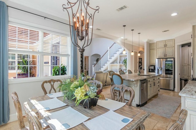 dining space featuring arched walkways, stairs, visible vents, and crown molding