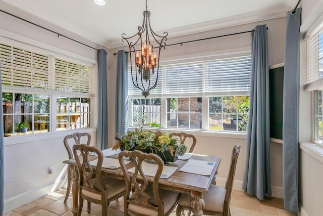 dining room featuring ornamental molding, a notable chandelier, baseboards, and stone tile floors