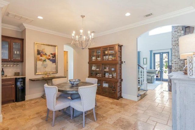 dining space featuring arched walkways, baseboards, visible vents, and stone tile floors