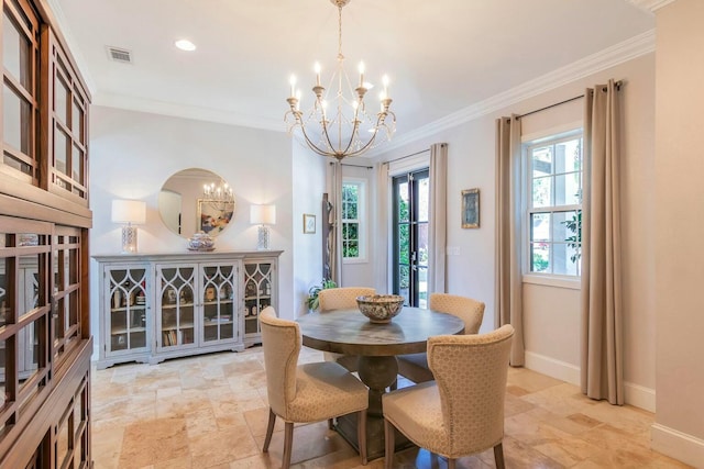 dining space featuring visible vents, an inviting chandelier, ornamental molding, stone finish flooring, and baseboards