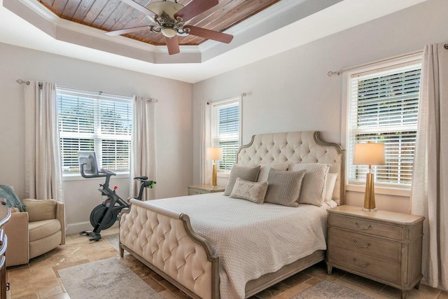 bedroom with a ceiling fan, a raised ceiling, wooden ceiling, and crown molding