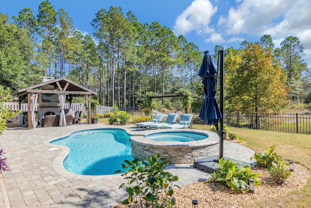 view of pool with a patio area, a fenced backyard, an outdoor fireplace, and a gazebo