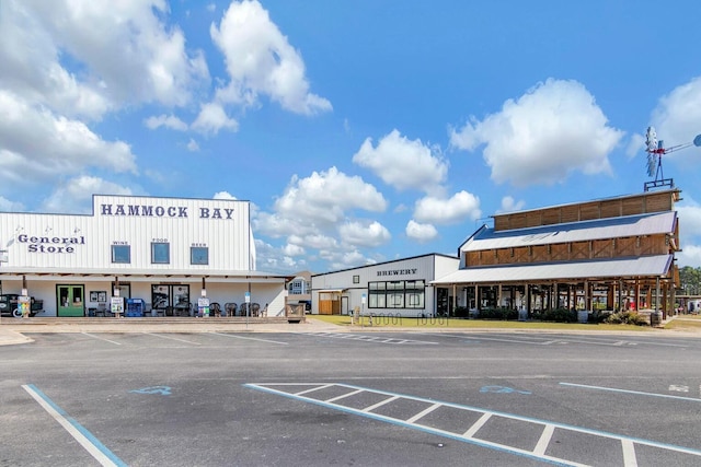 view of property featuring uncovered parking