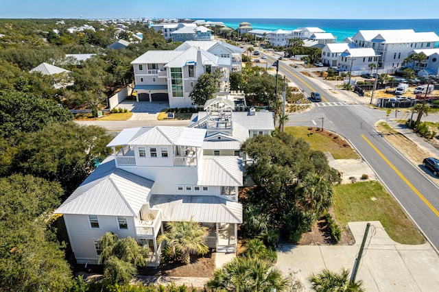 drone / aerial view featuring a residential view and a water view