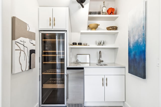 bar with wine cooler, high end refrigerator, and a sink