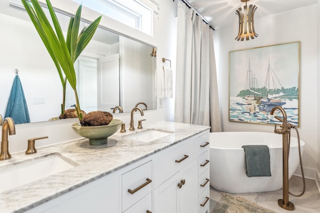 bathroom with a soaking tub, a sink, and double vanity