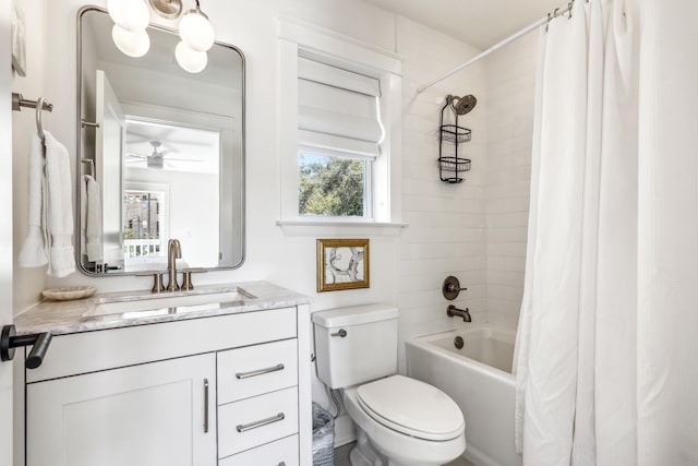 bathroom featuring toilet, ceiling fan, vanity, and shower / bathtub combination with curtain