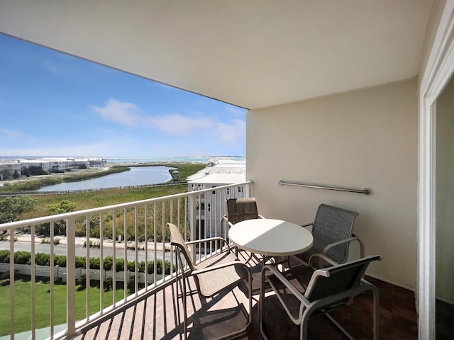 balcony featuring a water view