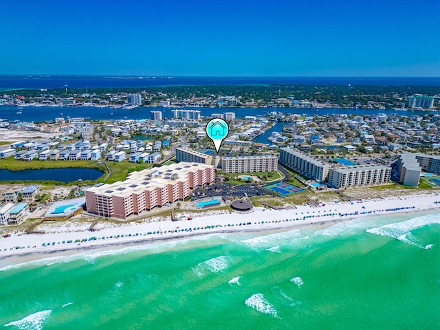 aerial view featuring a city view, a water view, and a beach view