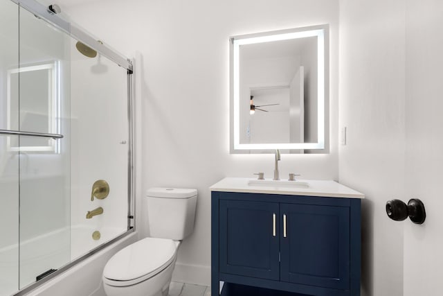 full bathroom with toilet, shower / bath combination with glass door, vanity, baseboards, and marble finish floor