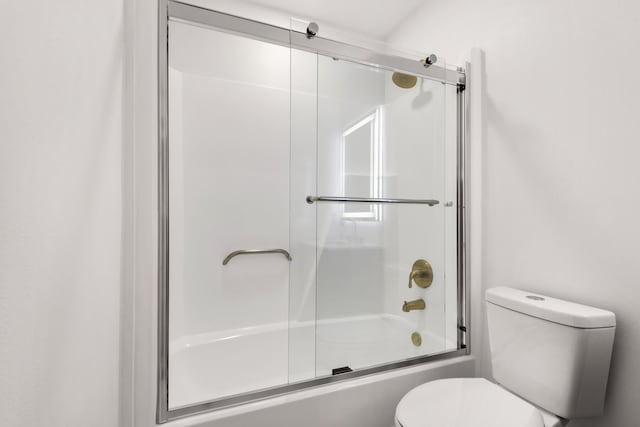 full bath with bath / shower combo with glass door and toilet