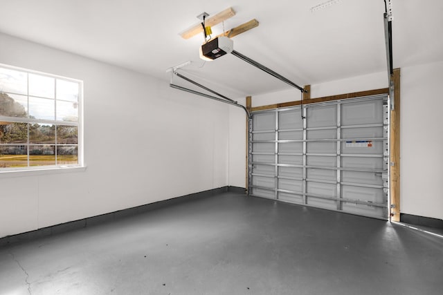 garage featuring baseboards and a garage door opener