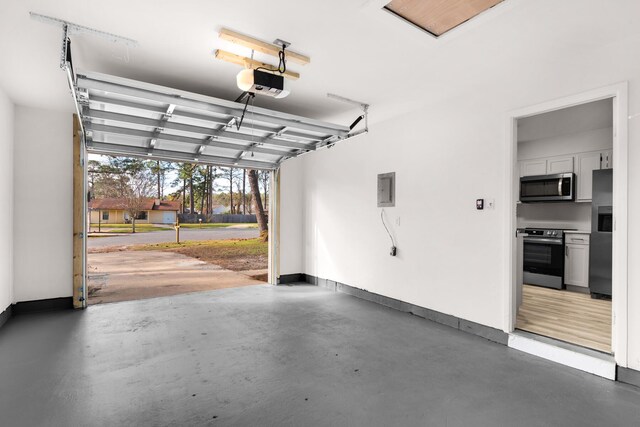 garage with electric panel, baseboards, stainless steel refrigerator with ice dispenser, and a garage door opener