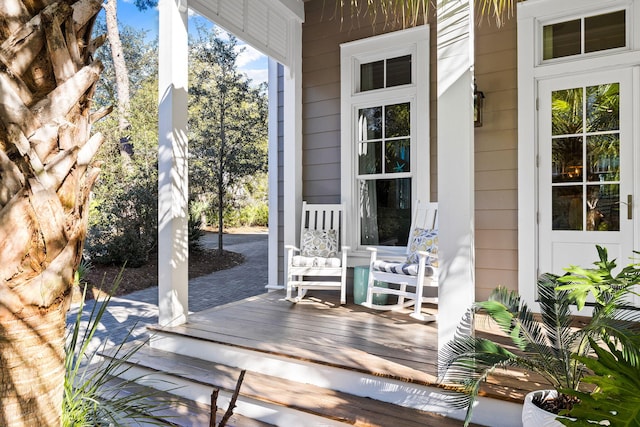 wooden terrace with a porch