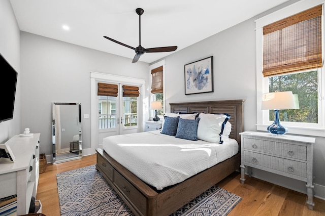 bedroom with access to outside, ceiling fan, light wood-style flooring, and baseboards