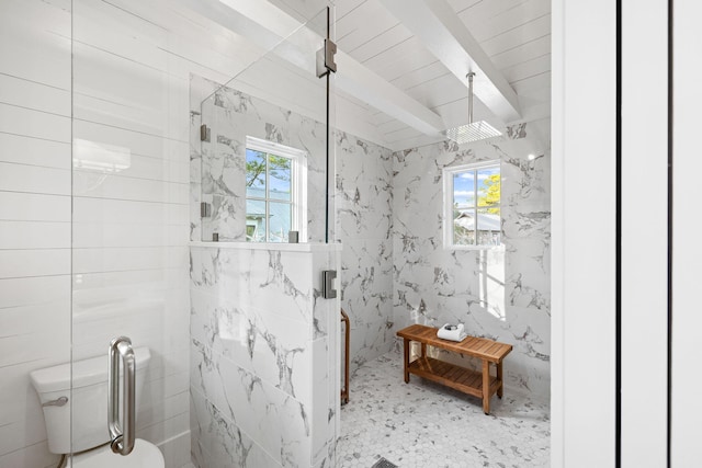 full bath with toilet, a shower stall, a wealth of natural light, and beamed ceiling