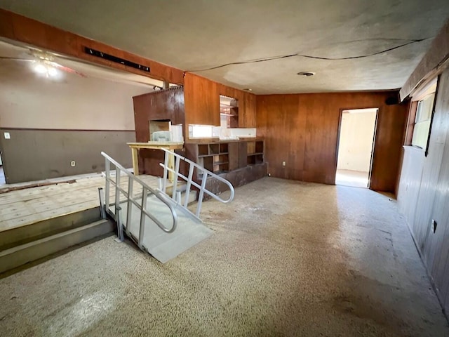 interior space featuring wood walls