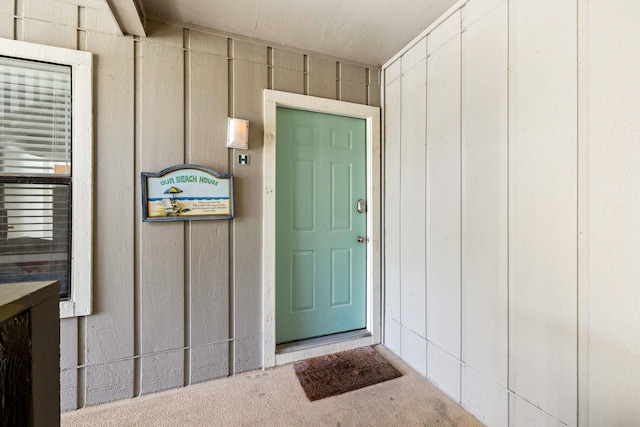 doorway to property with board and batten siding