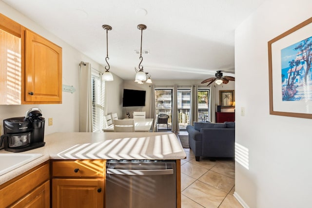 kitchen with visible vents, a peninsula, light countertops, and open floor plan