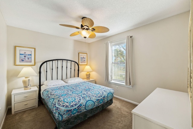 bedroom with ceiling fan, carpet, baseboards, and a textured ceiling