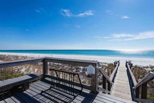 exterior space with a water view and a view of the beach