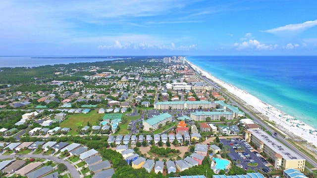 aerial view with a water view and a beach view