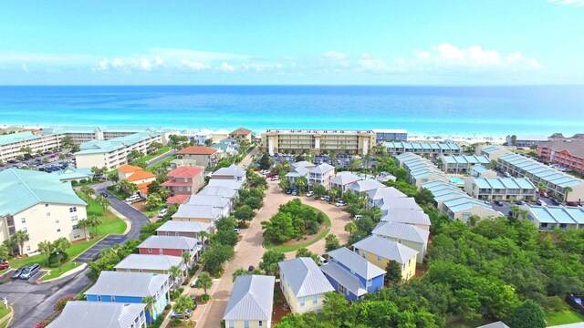 drone / aerial view with a water view and a residential view