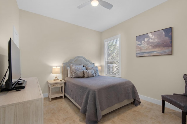 bedroom featuring light tile patterned floors, ceiling fan, and baseboards