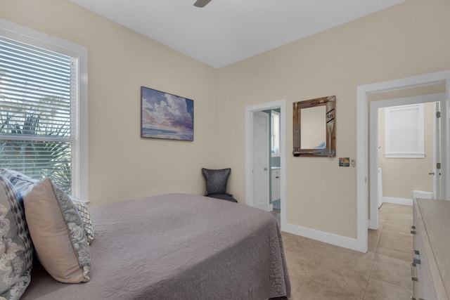 bedroom with light tile patterned floors, ceiling fan, and baseboards