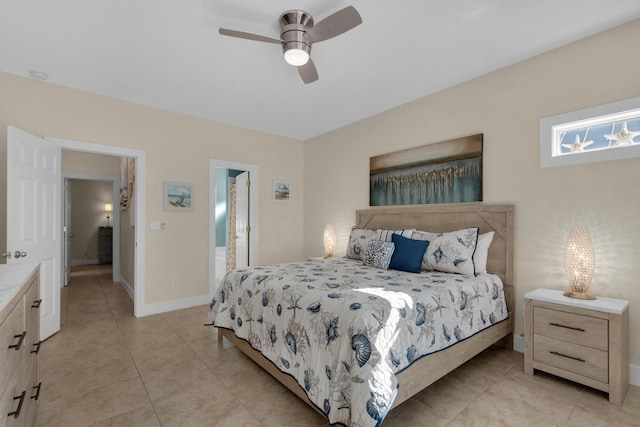 bedroom with light tile patterned floors, a ceiling fan, and baseboards