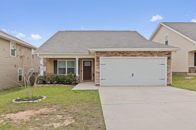 view of front of property featuring an attached garage, a shingled roof, concrete driveway, stone siding, and a front yard