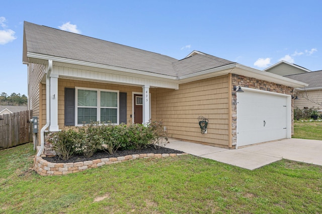 ranch-style home featuring a garage, fence, concrete driveway, roof with shingles, and a front lawn