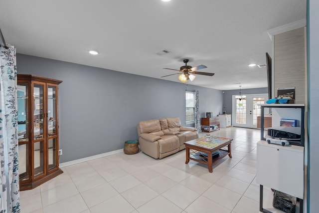 living room featuring baseboards, visible vents, a ceiling fan, light tile patterned flooring, and recessed lighting