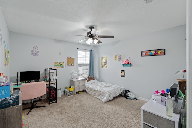 bedroom featuring a textured ceiling, carpet, and a ceiling fan