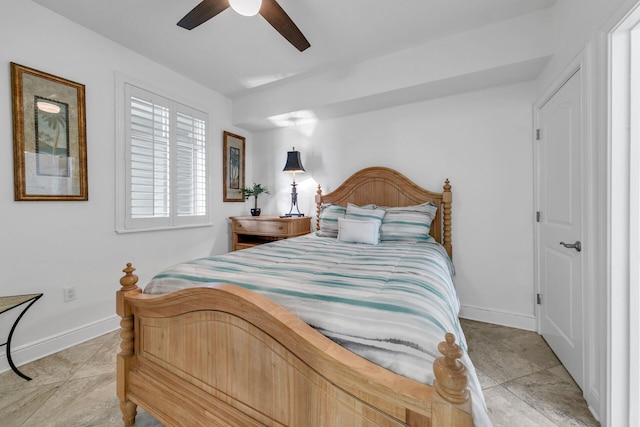 bedroom featuring light tile patterned floors, ceiling fan, and baseboards