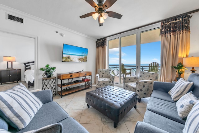 tiled living area featuring floor to ceiling windows, visible vents, a ceiling fan, and ornamental molding