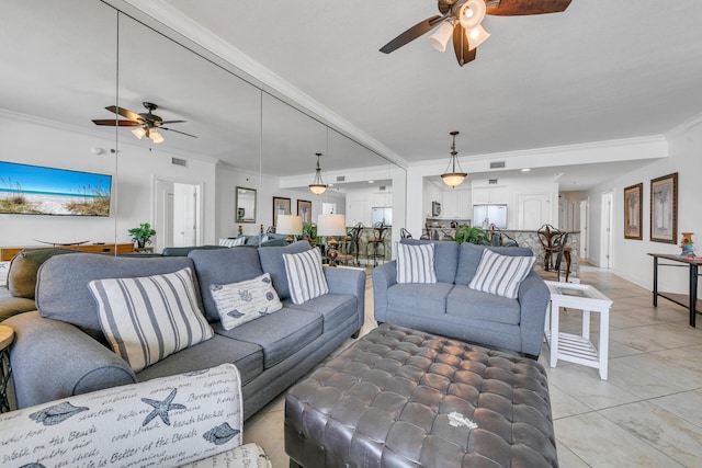 living area featuring a ceiling fan, visible vents, crown molding, and light tile patterned floors