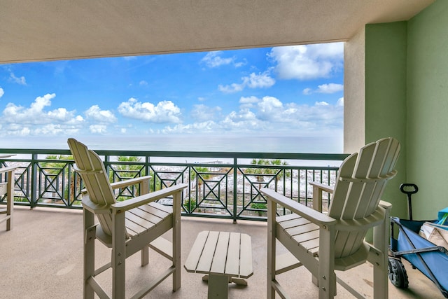 balcony featuring a water view