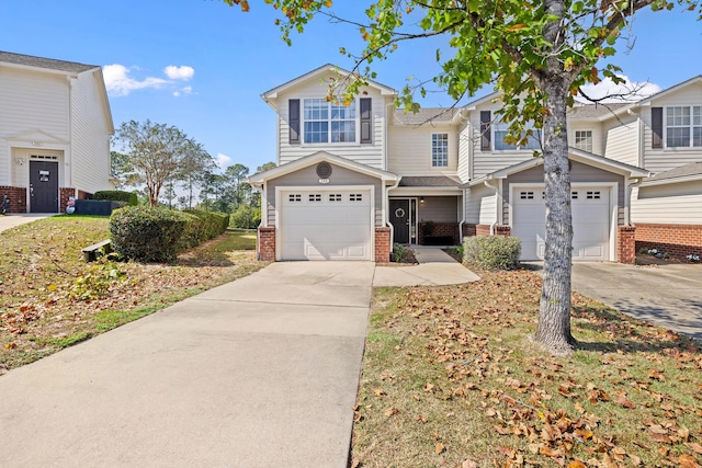 view of front of property featuring driveway and brick siding