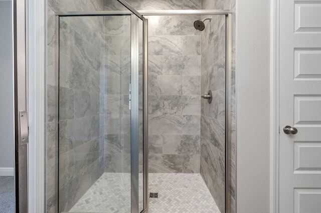 bathroom with a shower stall