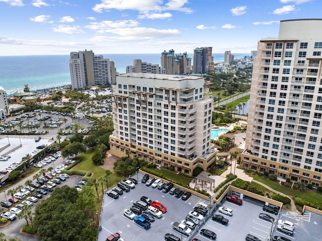 birds eye view of property featuring a view of city and a water view