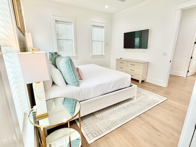 bedroom featuring light wood-style flooring, recessed lighting, and baseboards