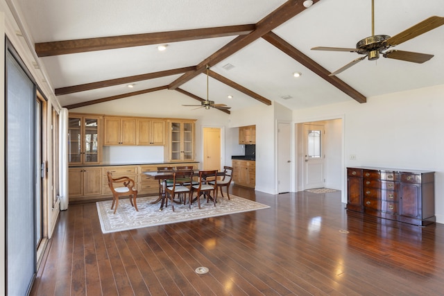 dining area featuring a ceiling fan, visible vents, lofted ceiling with beams, plenty of natural light, and dark wood-type flooring