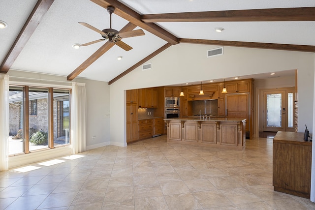 kitchen with visible vents, brown cabinetry, stainless steel appliances, a ceiling fan, and a sink