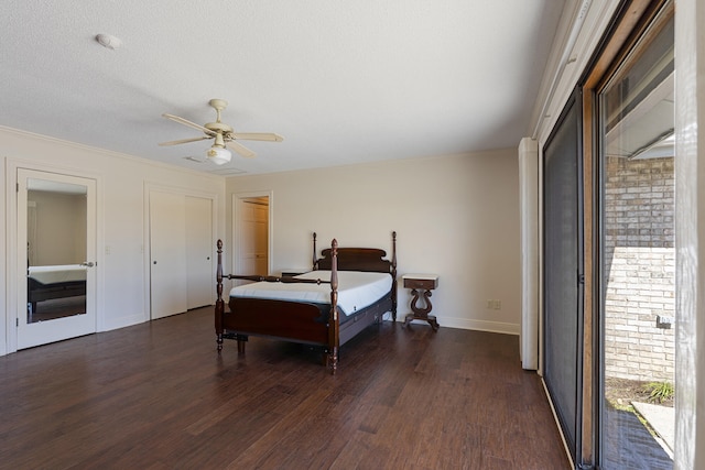 bedroom featuring dark wood-type flooring, baseboards, and ceiling fan